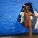 Noodles & Company employee Heather McDonough exits a shower tent after plunging into Ford Lake on Saturday, Feb. 16. Daniel Brenner I AnnArbor.com